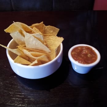 Cafe Azteca - Complimentary homemade corn tortilla chips with fresh spicy mango salsa. - Mexican Near Me