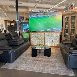 Black Leather Reclining Sectional with accent console table
