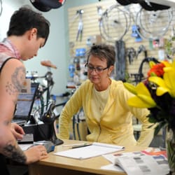 The BikeSmith - Rose ringing up a customer at the Grand Opening.