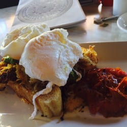 Aura Bar - Poached eggs, fried tomato, potTo, avocado: Rosti breakfast
