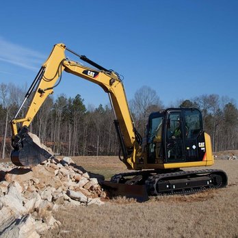RC Melville Construction - a large excavator in a field - Landscaping Near Me - Carver, Massachusetts RC Melville Construction - a large excavator in a field - Landscaping Near Me - Carver, Massachusetts