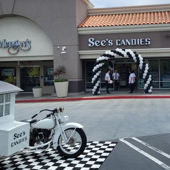 See's Candies - The grand opening celebration included an old school delivery motorcycle side car, and a balloon arch. #DELICIOUS - Chocolatiers & Shops Near Me - Rolling Hills Estates, California See's Candies - The grand opening celebration included an old school delivery motorcycle side car, and a balloon arch. #DELICIOUS - Chocolatiers & Shops Near Me - Rolling Hills Estates, California