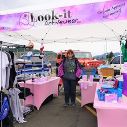 Sutherlin Farmers’ Market - Jennifer Kilpatrick of Look-it Activewear displaying one of the sweatshirts they have made.