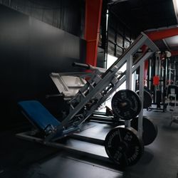 Athletic Empire Gym - Linda's leg press, squat press.