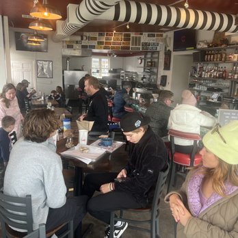 Belmont Deli - people sitting at tables in a restaurant - Delis Near Me - Edwards, Colorado Belmont Deli - people sitting at tables in a restaurant - Delis Near Me - Edwards, Colorado