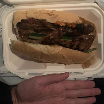 Saiguette - Hand size comparison to lemongrass pork Bahn mi ($12) - Vietnamese Near Me - Manhattan, New York