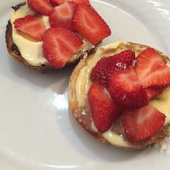 Babushkas Bagels - Raisin & Cinnamon Bagel toasted  cut in half with mascarpone and topped with fresh strawberries and maple syrup. Delish! - Bakeries Near Me