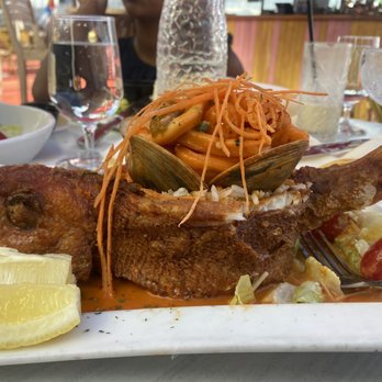 Zona De Cuba - Papi Rellename El Piscado (Whole snapper filled with coconut rice, clams, shrimp, and bay scallops) - Cuban Near Me - Bronx, New York Zona De Cuba - Papi Rellename El Piscado (Whole snapper filled with coconut rice, clams, shrimp, and bay scallops) - Cuban Near Me - Bronx, New York
