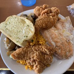 Asian Buffet - Fried rice, mushrooms, chicken strips, salmon, and garlic bread.