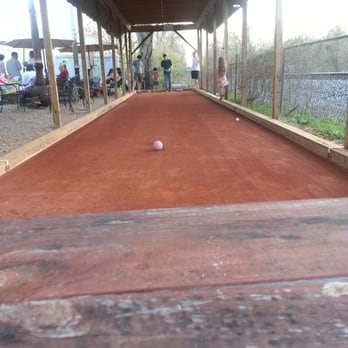 Depot Street Brewing - Some weird game that looks like curling in clay.  I think it's some kids bday party.  At the brewery. Kewl - Breweries Near Me - Jonesborough, Tennessee