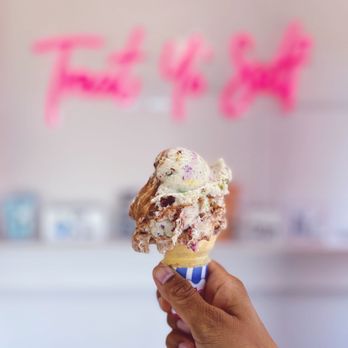 JJ's Custard Co - a hand holding an ice cream cone - Ice Cream & Frozen Yogurt Near Me - Dearborn, Michigan