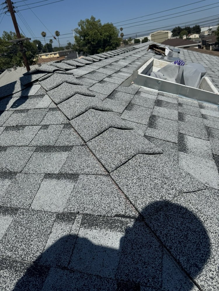 Slide of Alpha Roofing Group