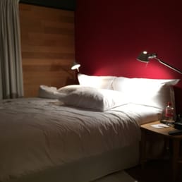 Bed with red wall