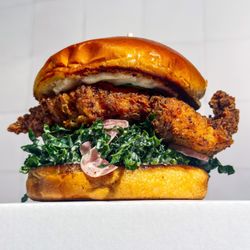 Bright Spark Brewing - Fried Chicken with House-Made Pickles, Tahini Ranch, Pickled Onions, and Kale Slaw on a Toasted Brioche Bun.