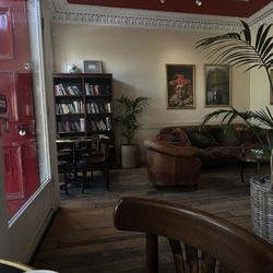 Victor Hugo - Indoor seating with bookshelf and sofa