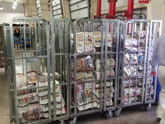 Photo of Tampa Bay Times - Saint Petersburg, FL, US. After inserts are added (special sections & ads) the papers are bound and loaded into these racks which are wheeled to trucks