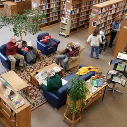 Door County Library - Sturgeon Bay - Comfortable seating with tall ceilings and a view to the second level.