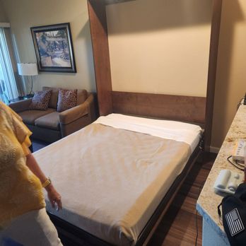 The Oasis Resort - Look how high off the floor this bed is and how thin the mattress is.  This is not a standard queen bed. - Resorts Near Me - Palm Springs, California