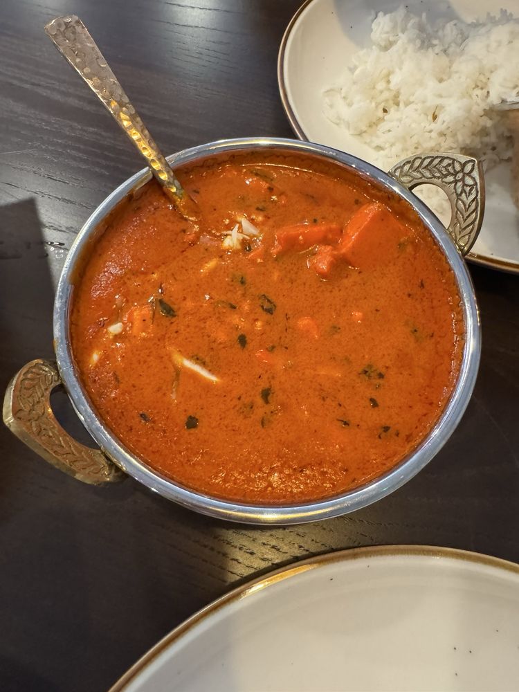 TAJ Indian Cuisine Logo