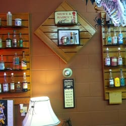 Dick & Arnie's Barber Shop - A cool collection of old hair and shaving products is displayed on the wall.