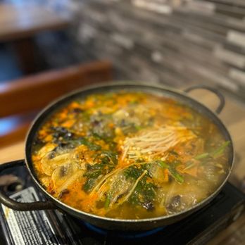 Ahjoomah's Apron - a pot of soup on a stove - Korean Near Me - Chicago, Illinois