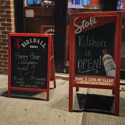 Happy hour sign, Kitchen is open sign outside