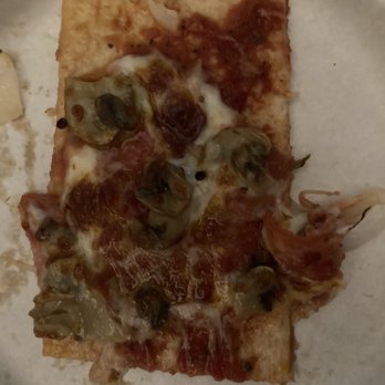 Marco's Pizza - a slice of pizza on a plate - Pizza Near Me - Enid, Oklahoma