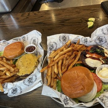 The Spoke on Center - Bob burger on the left and Caprese burger on the right. - American Near Me - Moab, Utah