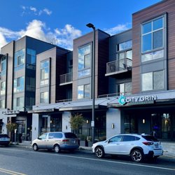 City Grin Orthodontics - We are located in the Flyway apartment building retail space and right accross from Kenmore City Hall. Plenty of street parking available!