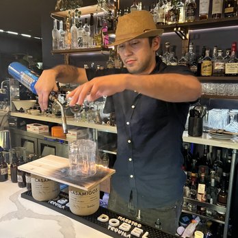 Korner 67 - JJ making a smoked old fashion - Cocktail Bars Near Me - Miami Lakes, Florida