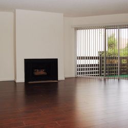 Kelton Towers Apartments - Living room area with hardwood floors