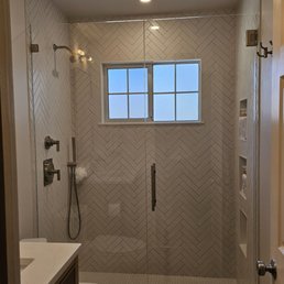 Shower door and fixed panel installed by All About Glass. Shower door and fixed panel installed by All About Glass.