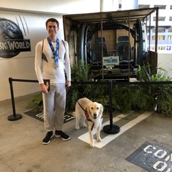 Center for Autism and Related Disorders - Caleb and his service dog Rowdy at Universal Studios.