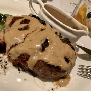 The Capital Grille - Dry Aged NY Strip with Courvoisier sauce - Steakhouses Near Me - Orlando, Florida The Capital Grille - Dry Aged NY Strip with Courvoisier sauce - Steakhouses Near Me - Orlando, Florida