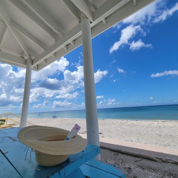 Manasota Key Resort - Looking out from the covered seating area at the sea wall. So relaxing to sit out here and take it all in! - Hotels Near Me - Englewood, Florida