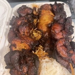 Teriyaki chicken on a stick with white rice. Teriyaki chicken on a stick with white rice.