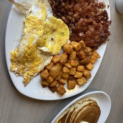 Perkins American Food - Corn, beef, hash with eggs, potato, and pancakes
