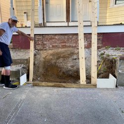 3 Star Builders - Where the steps are going. All that dirt and rock had to be removed and a cement pad poured for the landing.