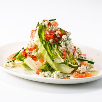 Stoney River - a plate of salad with lettuce and tomatoes - Steakhouses Near Me - Towson, Maryland Stoney River - a plate of salad with lettuce and tomatoes - Steakhouses Near Me - Towson, Maryland