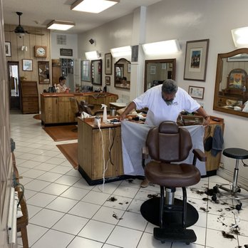 Wally's Barber Shop - My long COVID hair all over the floor after Rudy's fresh cut - Barbers Near Me - Laguna Beach, California