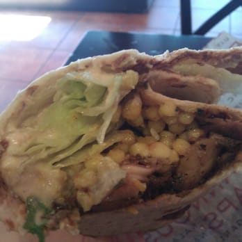 Roti - Laffa wrap with "roti chicken," hummus, coucous, tomato-cucumber salad, and lettuce. - Mediterranean Near Me - Chicago, Illinois Roti - Laffa wrap with "roti chicken," hummus, coucous, tomato-cucumber salad, and lettuce. - Mediterranean Near Me - Chicago, Illinois