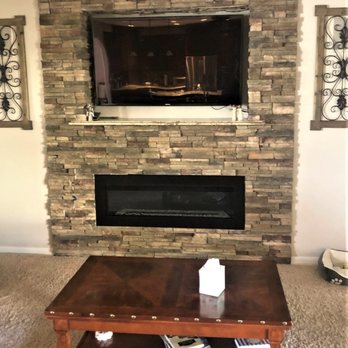 Albuquerque Tile and Stone - a living room with a fireplace - Countertop Installation Near Me - Albuquerque, New Mexico