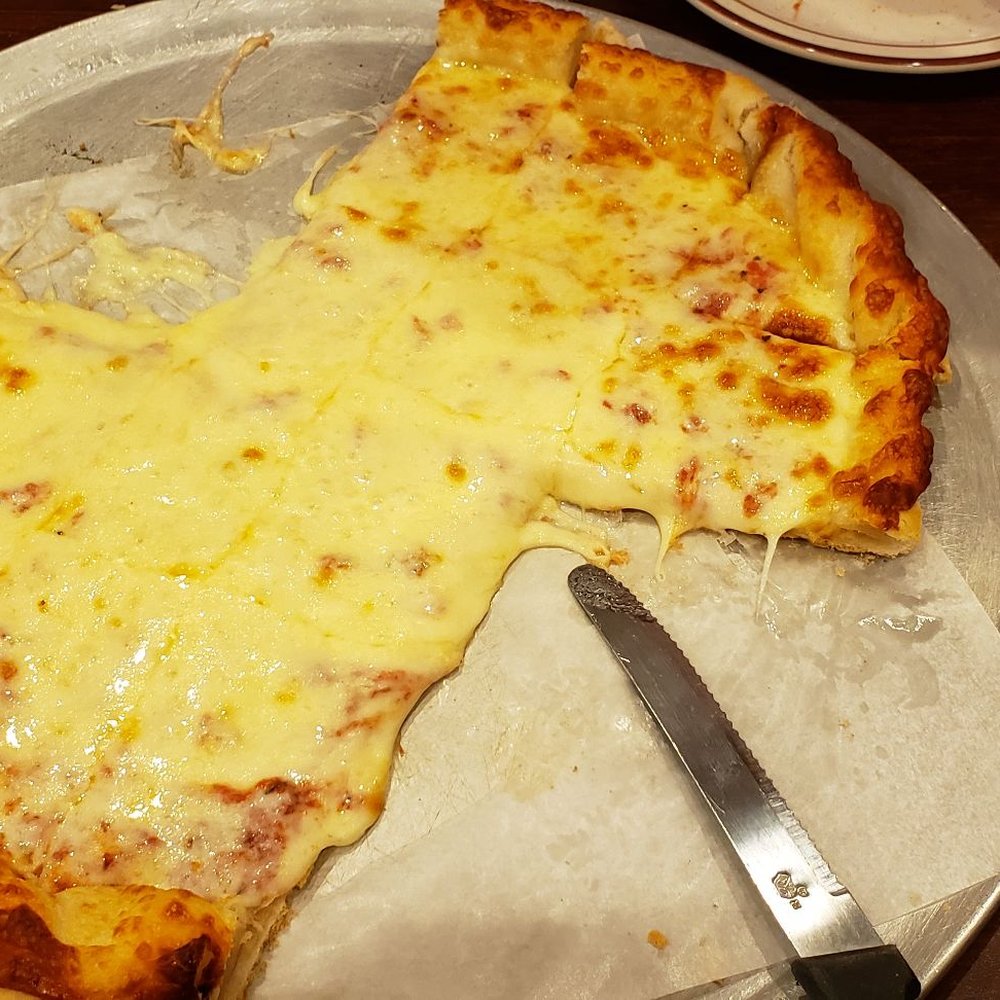 Winn's Pizza & Steakhouse - Large cheese pizza, very unique crust. - Pizza Near Me - Norwalk, Iowa Winn's Pizza & Steakhouse - Large cheese pizza, very unique crust. - Pizza Near Me - Norwalk, Iowa