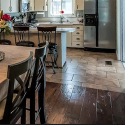 The tile floor in this kitchen was dated, we tore up the old tile and replaced with these 12x24.