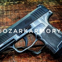 The Ozark Armory - Some of the crazy custom Cerakote they offer.