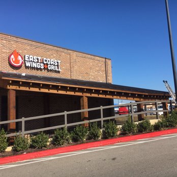 East Coast Wings + Grill - I love how this patio roof fits with the driveway. - American Near Me - Bartlett, Tennessee East Coast Wings + Grill - I love how this patio roof fits with the driveway. - American Near Me - Bartlett, Tennessee