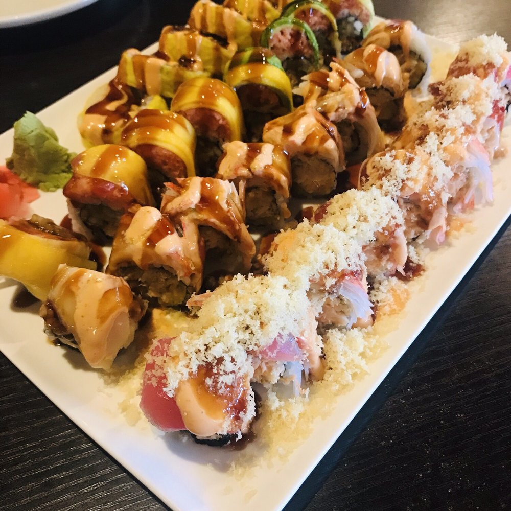 Sushi Bar - Delicious rolls. From back to front: -sun roll -twins roll -spicy girl -tiger - Sushi Bars Near Me - Indianapolis, Indiana Sushi Bar - Delicious rolls. From back to front: -sun roll -twins roll -spicy girl -tiger - Sushi Bars Near Me - Indianapolis, Indiana