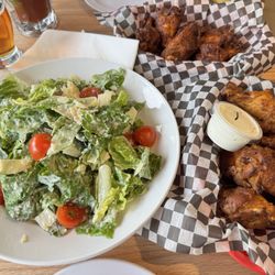 Caesar salad w/ tomatoes, Scar Jerry wings (top), Lucky 13 wings (bottom)