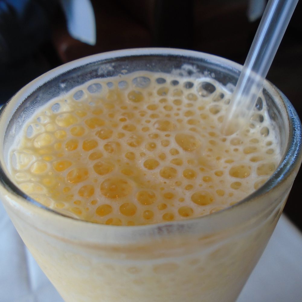 India Palace - Mango milk shake, close-up. - Indian Near Me - Woodbury, Minnesota India Palace - Mango milk shake, close-up. - Indian Near Me - Woodbury, Minnesota