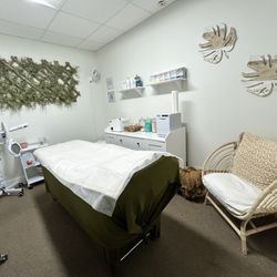Allure Waxing Studio - Seating area. Wax table, products etc.